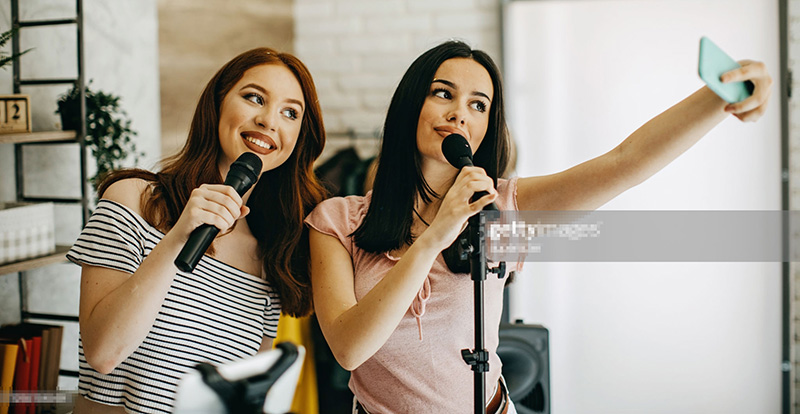 young woman holding a wireless microphone 2
